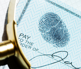 Fingerprint on a check under a magnifying glass